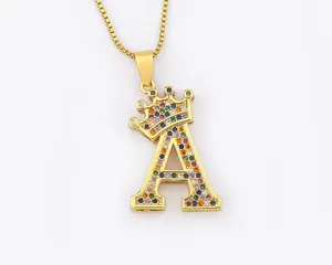 Gold crown letter A pendant necklace with colorful cubic zirconia stones for women detail view.