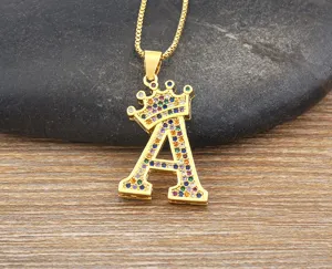 Detailed view of the stylish gold crown letter A pendant necklace with colorful cubic zirconia.