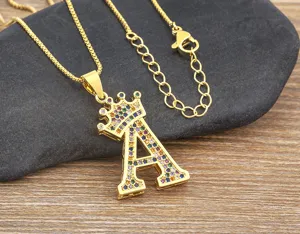 Close-up detail of the dazzling gold crown letter A pendant necklace with colorful cubic zirconia.