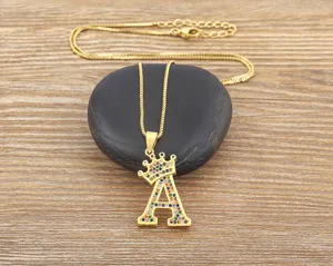 Close-up detail of the gold-colored letter A crown pendant necklace with colorful zircons.
