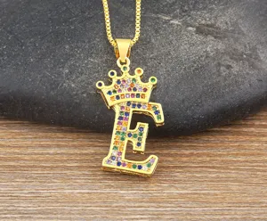 Gold-plated alphabet E pendant necklace with colorful cubic zirconia crown design for women.