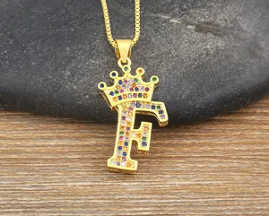 Gold crown letter F pendant necklace with colorful cubic zirconia for women, elegant fashion detail.
