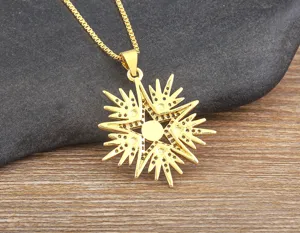 Close-up detail shot of the gold-plated star pendant necklace, showcasing delicate pave stones.