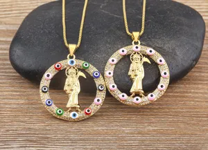 Gold plated retro grim reaper pendant necklace with cubic zirconia and evil eye details.