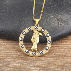 Gold plated grim reaper pendant necklace with evil eyes and sparkling cubic zirconia stones.