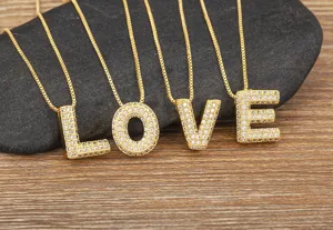 Detailed view of the 26 English letter pendant necklaces, cubic zirconia micro-paved gold chain jewelry.