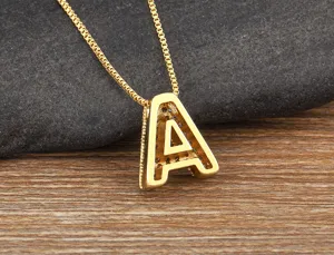 Gold micro pave cubic zirconia letter A pendant necklace closeup product detail shot.