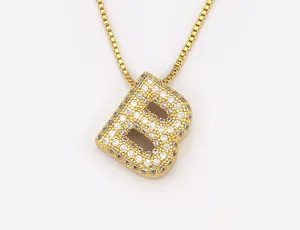 Gold-plated brass letter B pendant necklace detail, fully micro-paved cubic zirconia crystals.