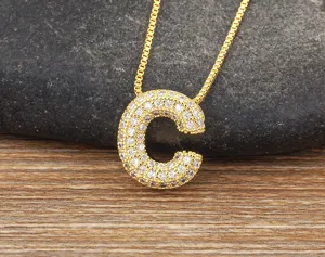Exquisite gold pave cubic zirconia letter C pendant necklace detail showcasing micro-set stones.
