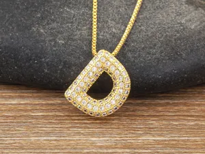 Gold micro-pave cubic zirconia letter D pendant necklace, elegant clavicle chain jewelry.