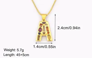 Gold plated letter A pendant necklace with colorful cubic zirconia stones detail view.