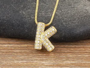 Gold letter K pendant necklace with pavé cubic zirconia on chain, elegant clavicle jewelry.