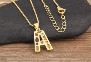 Close-up detail of the 18K gold plated letter A pendant necklace with colorful cubic zirconia.