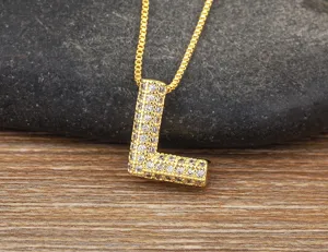 Gold micro-paved cubic zirconia letter L pendant necklace exquisite detail close-up shot.