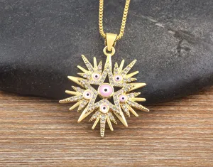 Gold plated evil eye star pendant necklace with cubic zirconia details close up view