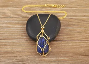Detail view of 18k gold plated wire wrap pendant necklace with natural lapis lazuli stone.
