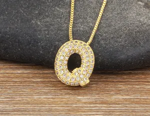 Gold micro-pave cubic zirconia letter Q pendant necklace, elegant chain for women and girls.