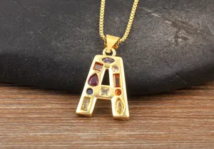 Gold-plated letter A pendant necklace detailed closeup, featuring colorful sparkling cubic zirconia stones.