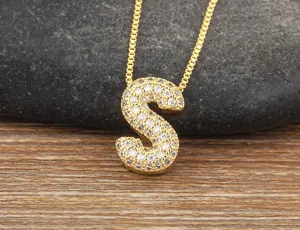 Gold micro pave cubic zirconia letter S pendant necklace delicate chain jewelry detail view