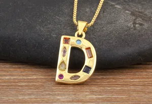 Detailed close-up view of gold letter D pendant necklace with colorful cubic zirconia.