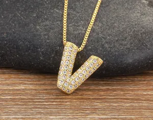 Gold-plated letter V pendant necklace featuring delicate micro-set cubic zirconia details.