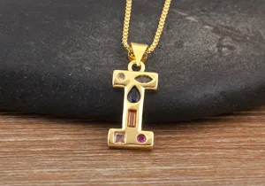 Detailed shot of gold-plated letter I pendant necklace with colorful cubic zirconia stones.