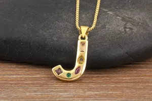 Gold-plated letter J pendant necklace with colorful cubic zirconia, fine box chain detail.