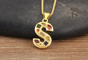 Gold-plated letter S pendant necklace featuring multi-colored cubic zirconia stones.