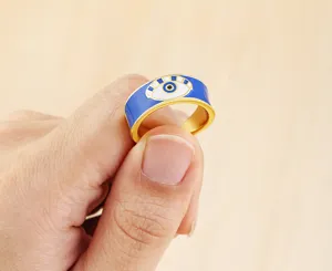 Closeup detail view of the stylish blue enamel evil eye adjustable ring, elegant design.
