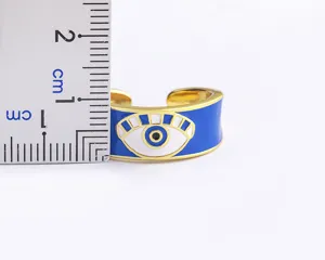 Close-up detail view of the 18K gold plated evil eye open ring, showing fine design.