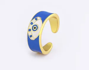 Close-up detail showcasing the exquisite gold-plated open ring with vibrant blue eye design.