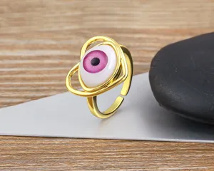 Gold plated open eye ring featuring a unique pink resin evil eye design for women fashion jewelry.
