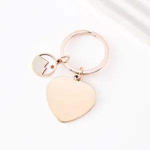 Stainless steel rose gold heart keychain with mountain pendant detail, blank metal charm.