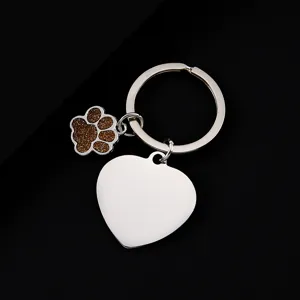 Stainless steel keychain with heart blank pendant and glitter paw charm for daily use.