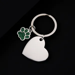Stainless steel metal keychain featuring a green glitter paw charm and a blank heart tag.