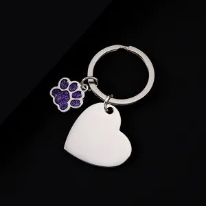 Stainless steel metal keychain with purple glitter paw print and blank heart pendant.
