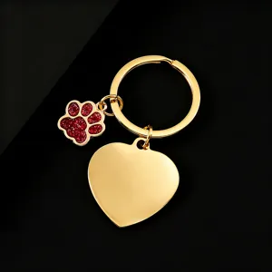 Gold metal keychain featuring a red glitter paw print and heart pendant for laser engraving.
