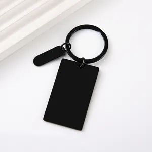 Detail shot of blank black rectangular stainless steel metal keychain for DIY engraving.