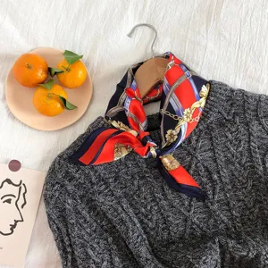 Silk square scarf featuring a chic red and blue chain belt design, elegant women accessory.