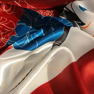Close-up detail of luxury abstract art silk scarf, smooth fabric texture and vibrant colors.