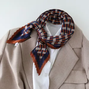 Pleated silk feel scarf detail view, elegant blue brown plaid square neckerchief styling.
