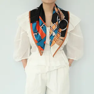 Detailed view of luxury style silk square scarf with classic belt and buckle print design.