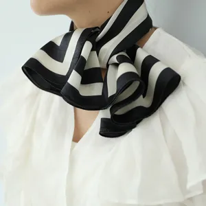 Minimalist black and white striped silk neck scarf, premium mulberry silk fabric detail.