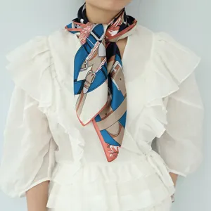 Detail view of stylish silk square scarf featuring elegant belt print for women fashion accessories