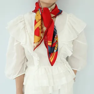 Detailed shot of women red silk square scarf with stylish belt print for elegant wear.