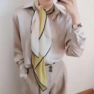 Elegante bufanda de seda para mujer con diseño de contraste chic, ideal para primavera.
