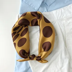 French retro silk scarf with brown polka dots, elegant women neckerchief detail shot.