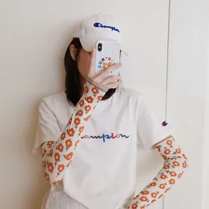 Mangas de protección solar con flores para mujer, cubrebrazos transpirables para deportes de verano.