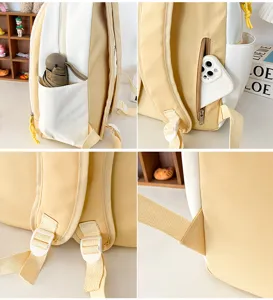 Primo piano dei dettagli dello zaino carino giallo e bianco, con tasca laterale e spallacci.