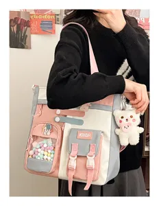 Sac à bandoulière en toile pour étudiant avec multi-poches, joli design et grande capacité.